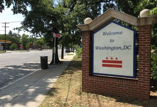 Outdoor brick sign with the words "Welcome to Washington, DC" printed. 