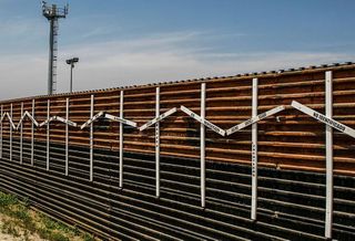 The crosses on the border fence, which Trump wants to replace, represent migrants who died in the crossing attempt, some identified, some not.   