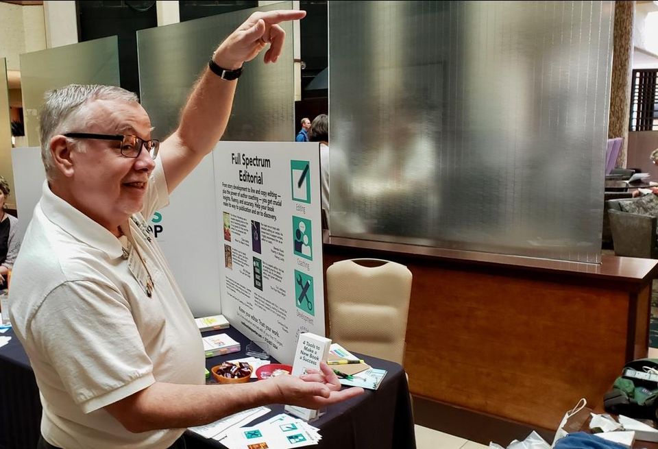 Author Ron Seybold shows how large of a flower eccentric and well-known Austinite Leslie Cochran used to wave around in downtown Austin.