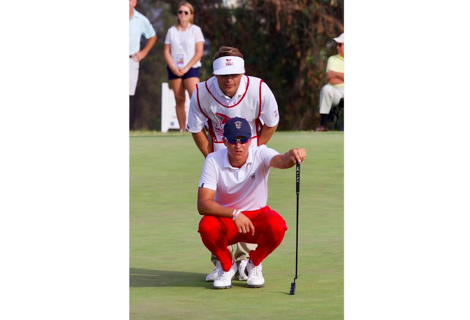 Bushnell caddying for Cameron Champ in the 2017 Walker Cup at Los Angeles Country Club