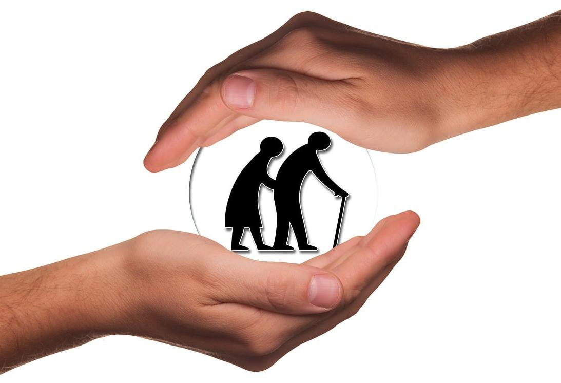 Two hands cupping a logo featuring senior citizens