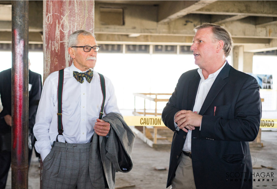 Bryan Dorsey (on the right) with Maxwell Drever while giving a tour of 1401 Elm