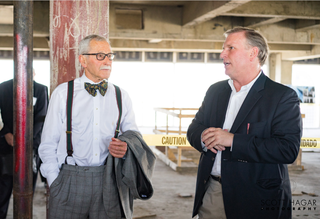 Bryan Dorsey (on the right) with Maxwell Drever while giving a tour of 1401 Elm