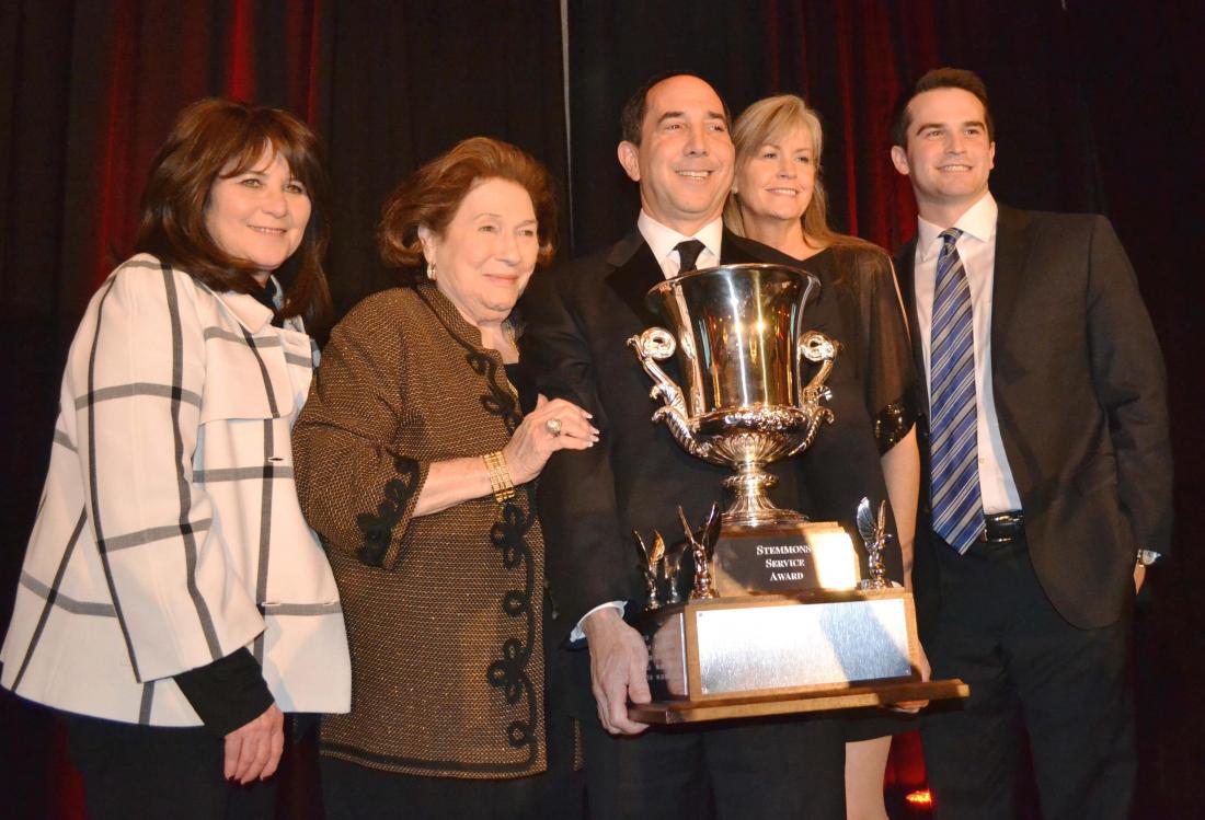 CBRE senior Vice President Steve Berger (here with his family) walked away with the big trophy. After a big celebration at the ceremony, Berger had a quiet celebration with family ant takeout food at home. 