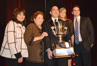 CBRE senior Vice President Steve Berger (here with his family) walked away with the big trophy. After a big celebration at the ceremony, Berger had a quiet celebration with family ant takeout food at home. 