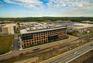 Needham Tries To Buck Trend Of Businesses Ditching Burbs For Boston