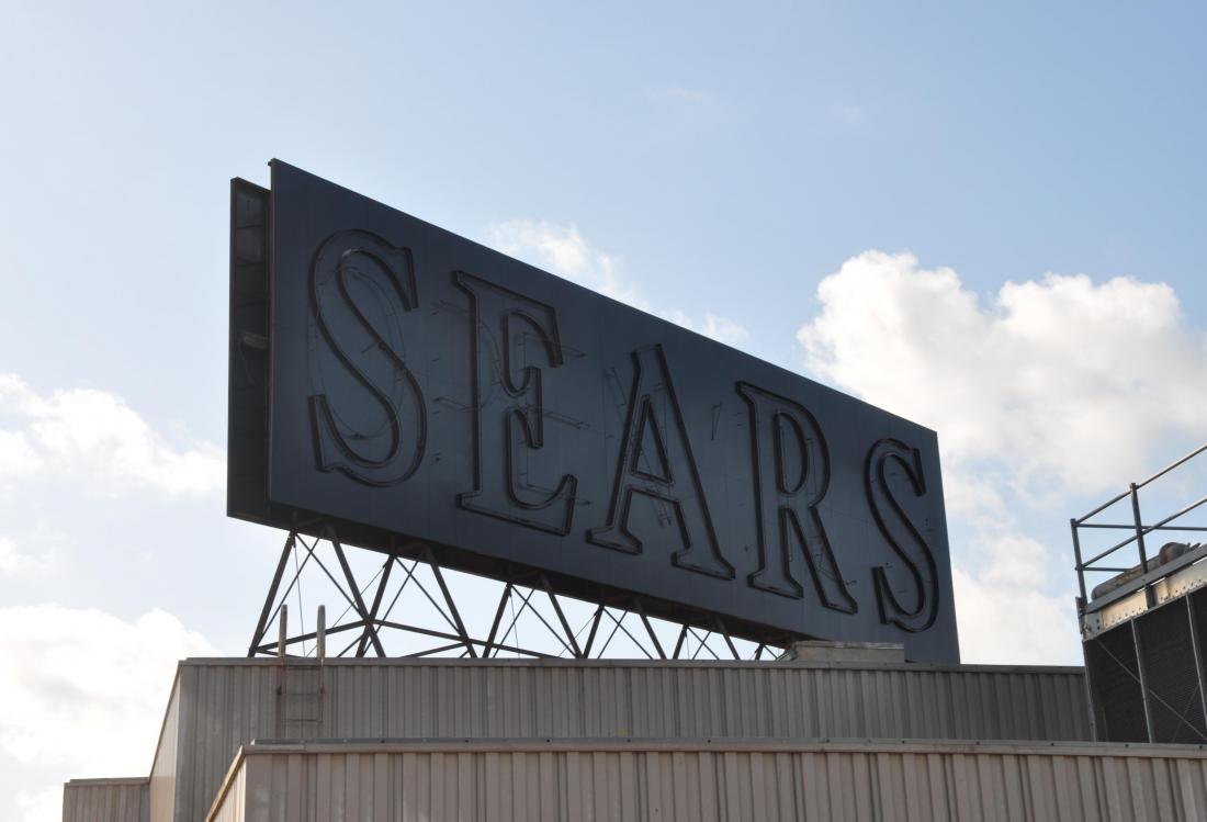 Sears' blacked out sign over its former Midtown location