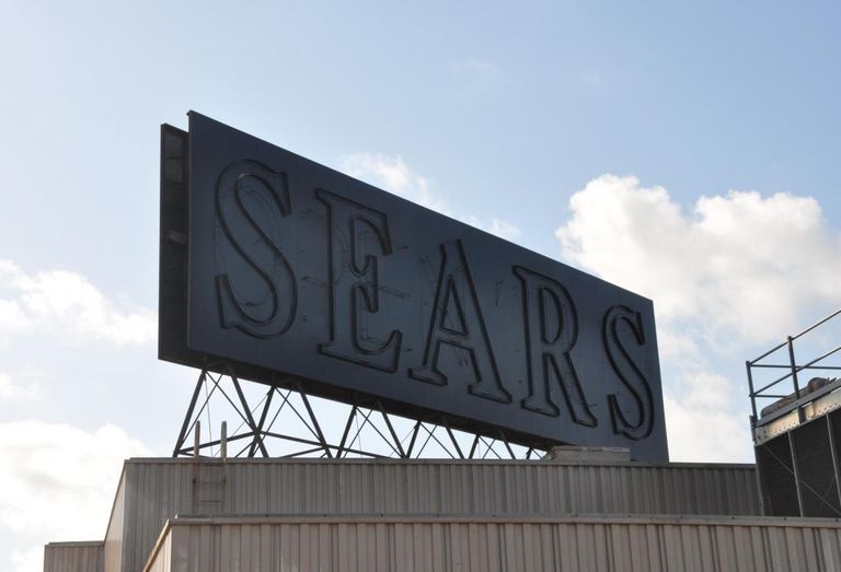 Sears' blacked out sign over its former Midtown location