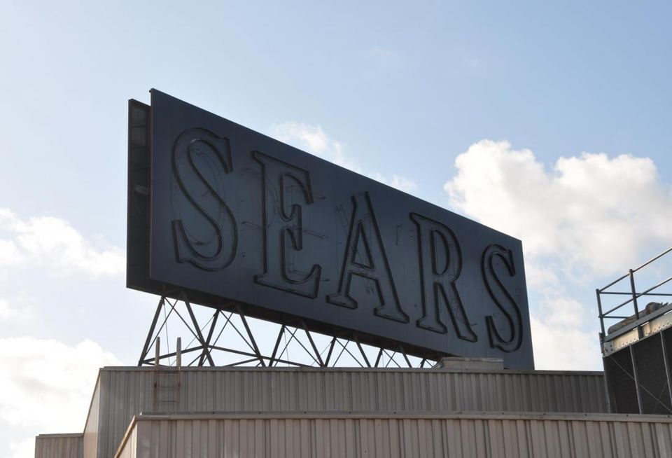 Sears' blacked out sign over its former Midtown location