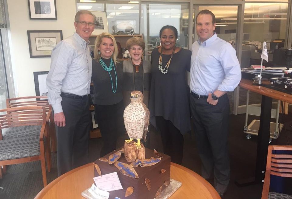 Before AmerisourceBergen signed 300k SF at Billingsley Co’s Austin Ranch in October, JLL swooped in to handle lease negotiations. JLL president Jeff Staubach repped AmerisourceBergen, but he didn’t do it owl by himself; managing director Greg Biggs, SVP Torrey Littlejohn and market director for the Carolinas Chase Monroe also repped the tenant. To sparrow AmerisourceBergen’s privacy, JLL and Billingsley called the deal Project Hawk until it became official. Partner Lucy Billingsley and SVP Marijke Lantz (who repped Austin Ranch in the deal) brought the JLL team a sweet tweet—treat, that is—in appreciation of their hard work in closing the deal. Gregg, Torrey and Jeff were pheasantly surprised by the hawk-inspired cake. Here’s Gregg, Marijke, Lucy, Torrey, Jeff before stuffing their beaks with the dessert.