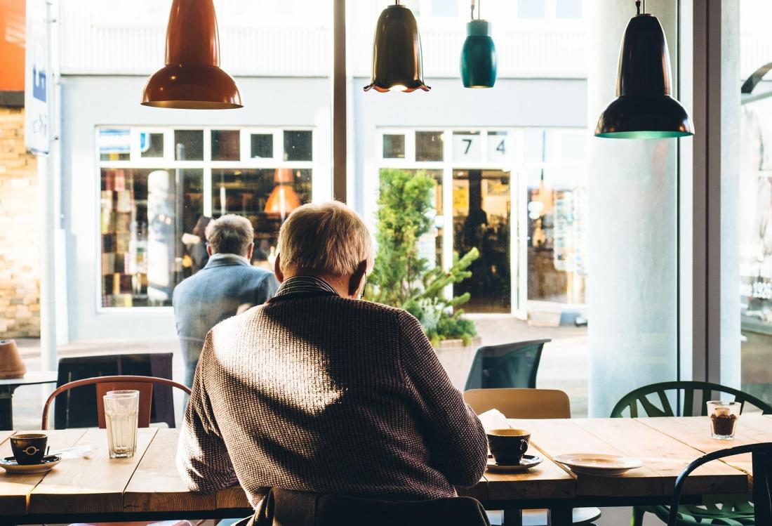 Senior sitting in a coffee shop