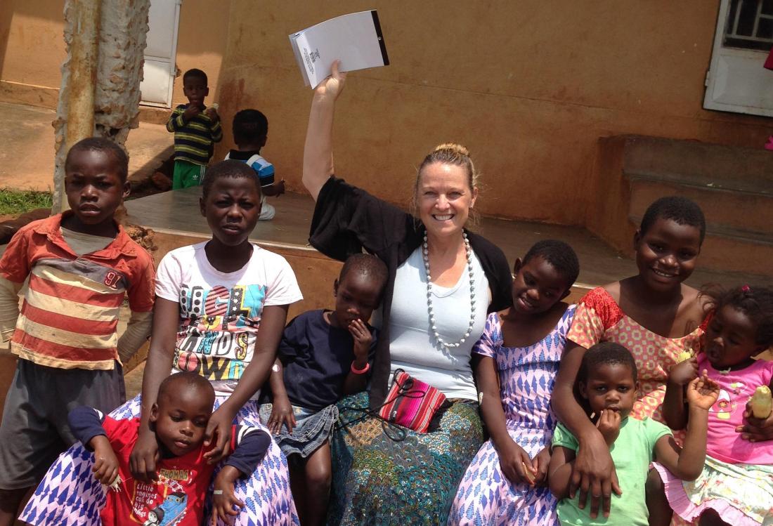 Kennedy Wilson Property Services' Christine Deschaine volunteers with Bringing Hope to the Family in Uganda.