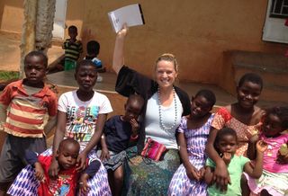 Kennedy Wilson Property Services' Christine Deschaine volunteers with Bringing Hope to the Family in Uganda.