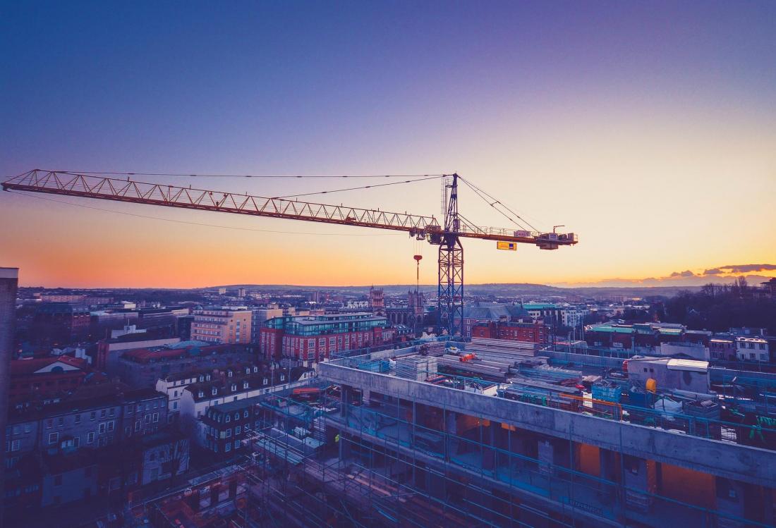 Cranes over sky