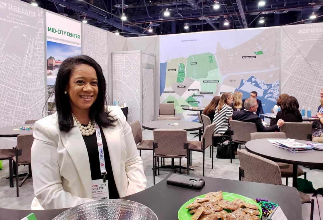 New Orleans Business Alliance Vice President of Small Business Ecosystem Development Lynnette White-Colin welcomes visitors to the city of New Orleans booth at the ICSC RECon convention in Las Vegas.