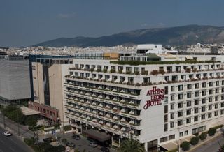 As Greece Reaches Debt Deal, Hines Dips Toe In Water
