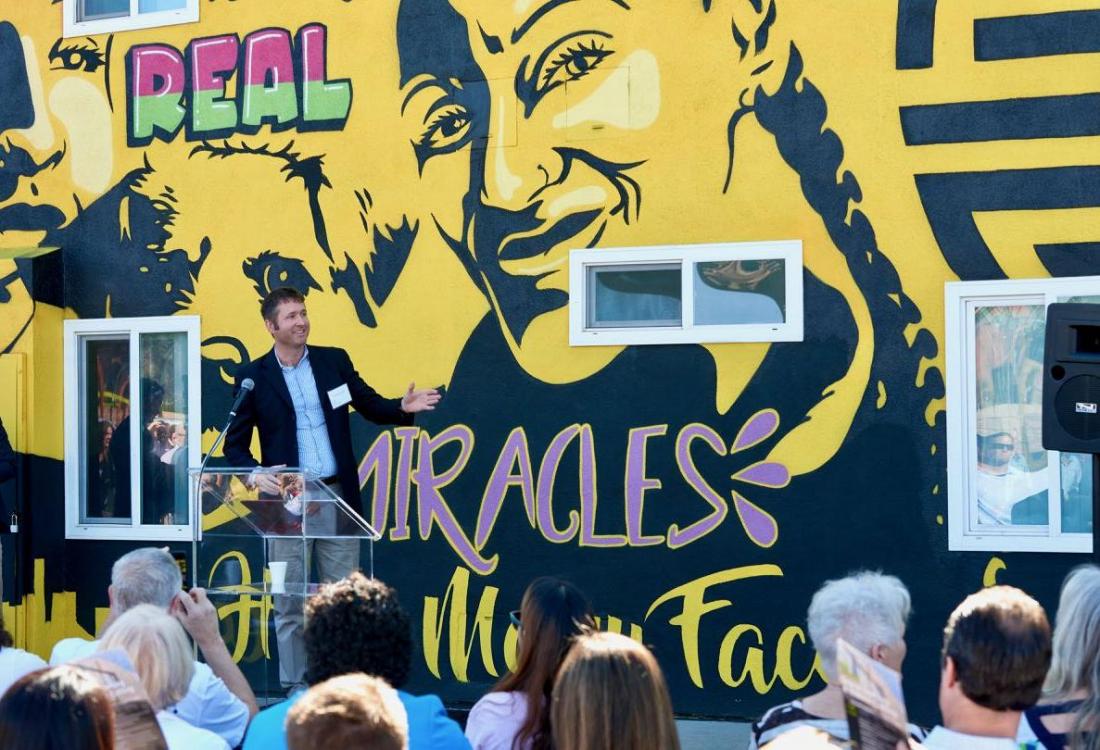 City of Santa Ana's Housing Division Manager For the Community Development Agency Judson Brown speaks at the opening of The Orchard, an affordable housing development. 