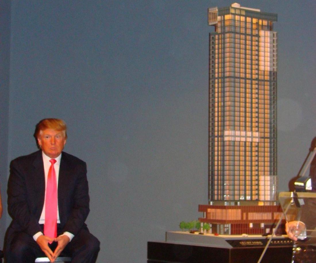 Donald Trump in 2007 with a scale model of the Trump SoHo Hotel
