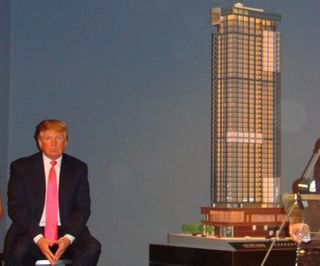 Donald Trump in 2007 with a scale model of the Trump SoHo Hotel