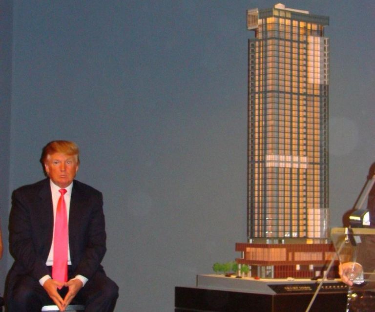Donald Trump in 2007 with a scale model of the Trump SoHo Hotel