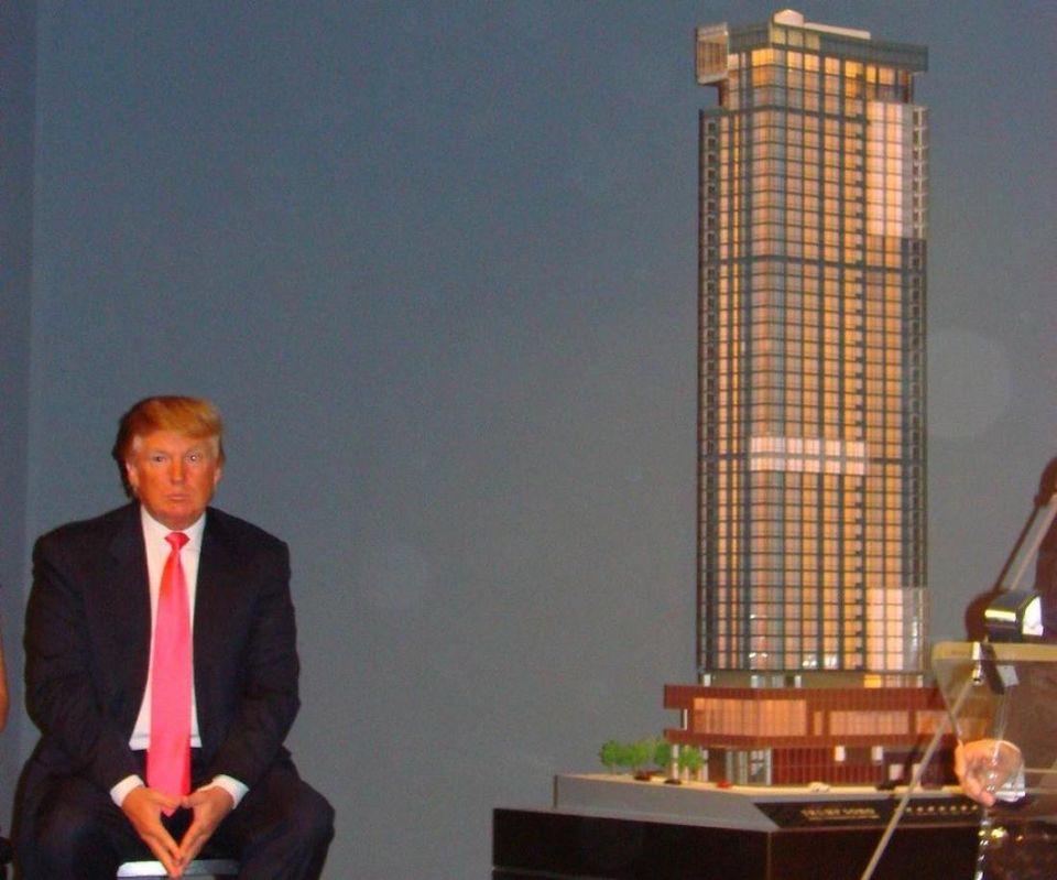 Donald Trump in 2007 with a scale model of the Trump SoHo Hotel