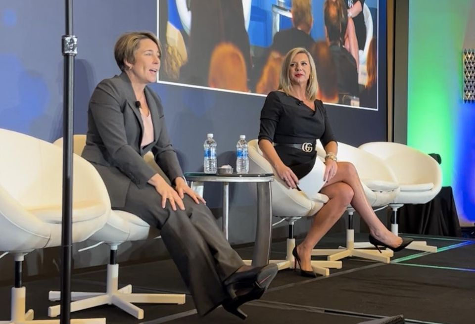 Gov. Maura Healey and MassBio CEO Kendalle Burlin O'Connell speaking at the MassBio State of Possible conference on Tuesday.