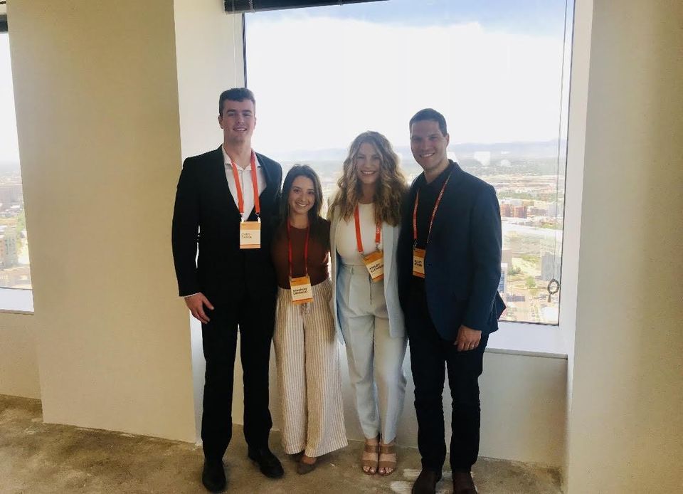 Bisnow Director of Sales Ashley Clendenin with the Bisnow Denver/Phoenix team at an industrial event in 2021