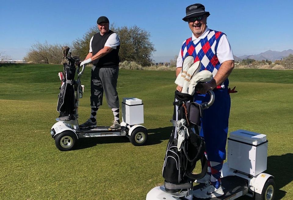 Golfers on motor scooters at Longbow Golf Course in Mesa, Arizona.