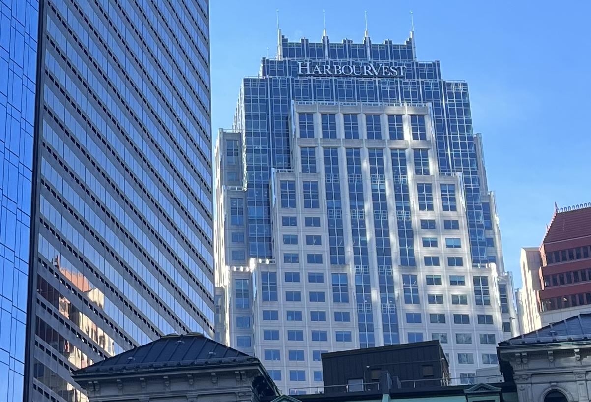 The One Lincoln office tower, featuring HarbourVest's name on the top. 