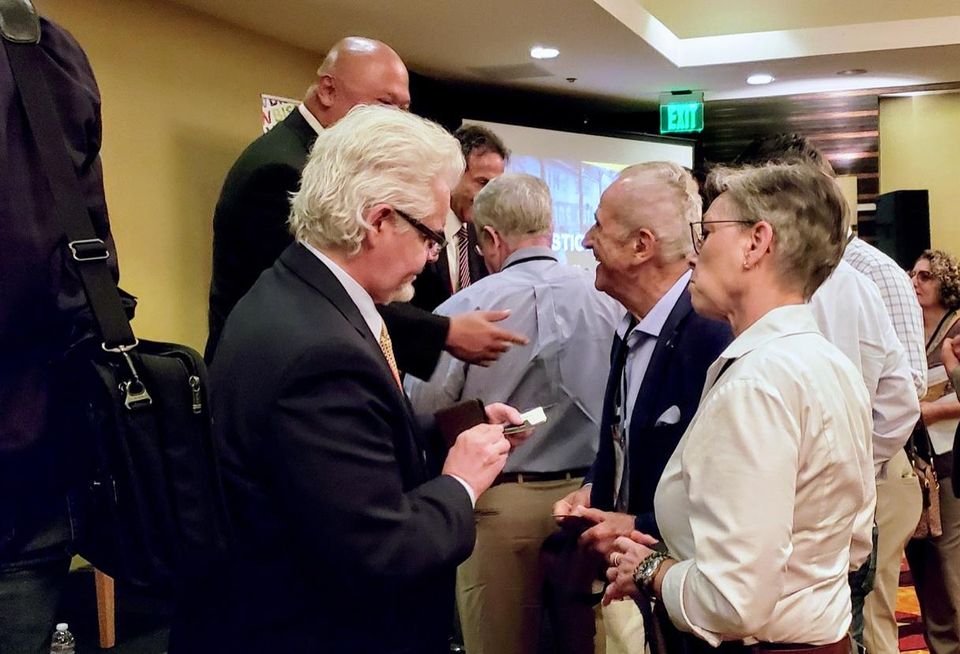 Attendees network after a panel at Bisnow's LA Opportunity Zones event held at The LA Grand Hotel Downtown.