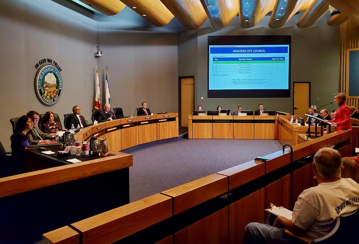 Los Angeles Angels Senior Vice President Molly Jolly (right) addresses the Anaheim City Council during a council meeting Dec. 20 at the Anaheim City Hall in Anaheim.