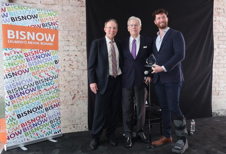 MATT Construction Chairman and CEO Steve Matt, Rising Realty Partners Chairman Nelson Rising and Bisnow's West Coast Director Michael Guimond at Bisnow's Los Angeles State of the Market at the Trust Building in downtown Los Angeles. Rising received Bisnow's lifetime achievement award, the Bizzy.