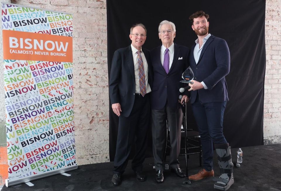 MATT Construction Chairman and CEO Steve Matt, Rising Realty Partners Chairman Nelson Rising and Bisnow's West Coast Director Michael Guimond at Bisnow's Los Angeles State of the Market at the Trust Building in downtown Los Angeles. Rising received Bisnow's lifetime achievement award, the Bizzy.