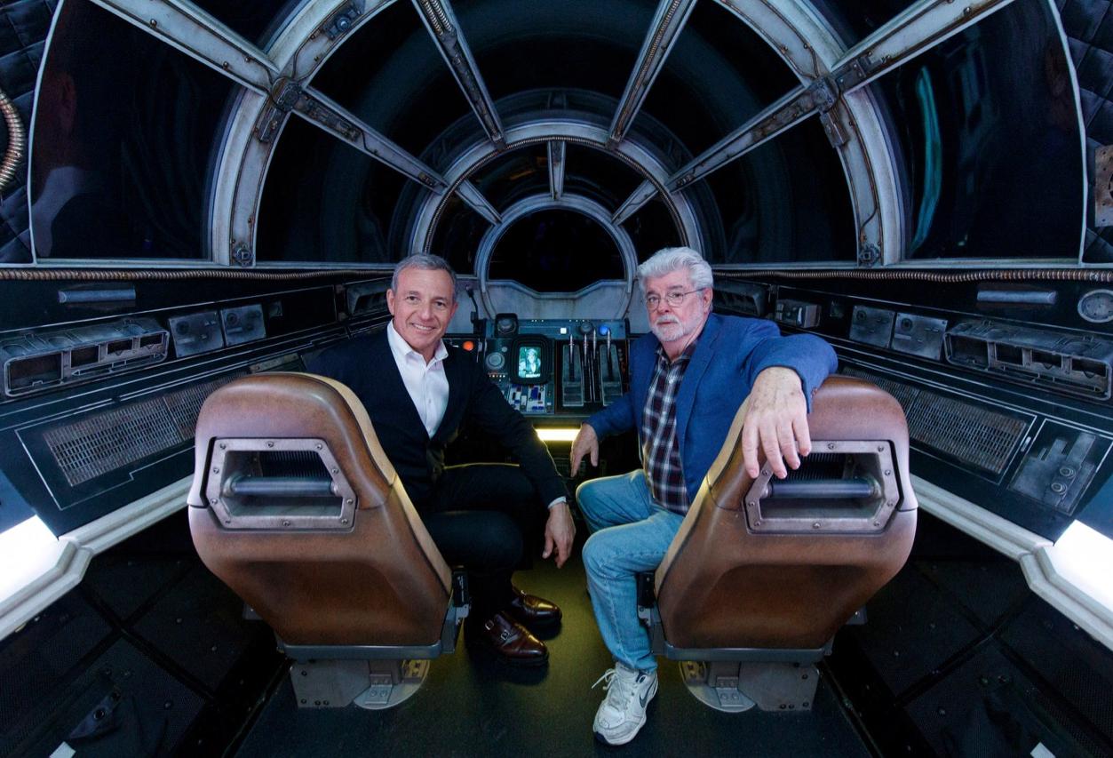The Walt Disney Co. Chairman and CEO Bob Iger and Star Wars creator George Lucas pose inside Millennium Falcon: Smugglers Run at Star Wars: Galaxy’s Edge at Disneyland Park in Anaheim, California.