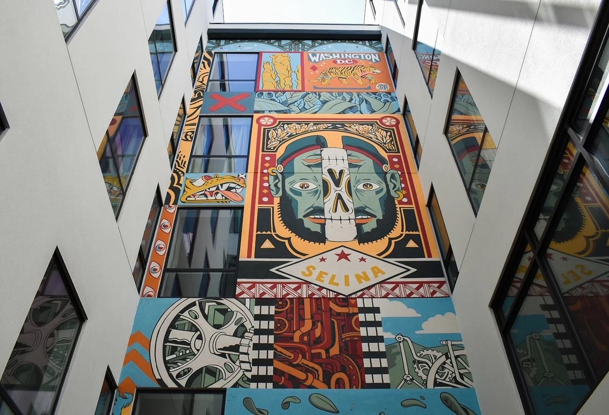 A mural in the courtyard of the Selina Union Market hotel
