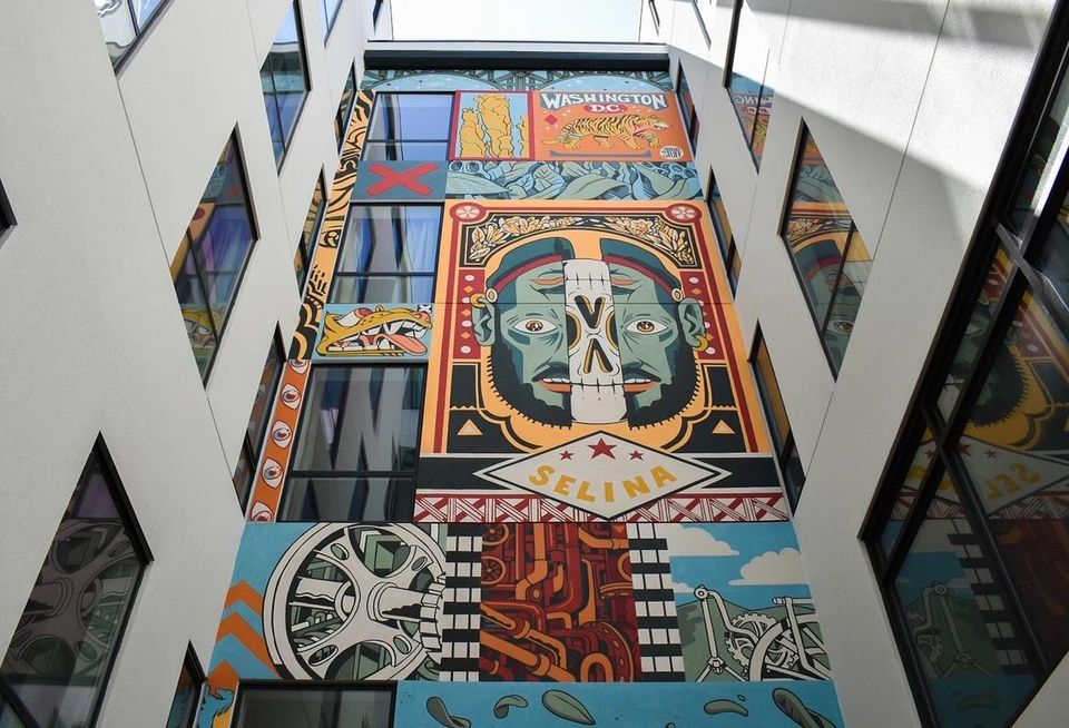 A mural in the courtyard of the Selina Union Market hotel