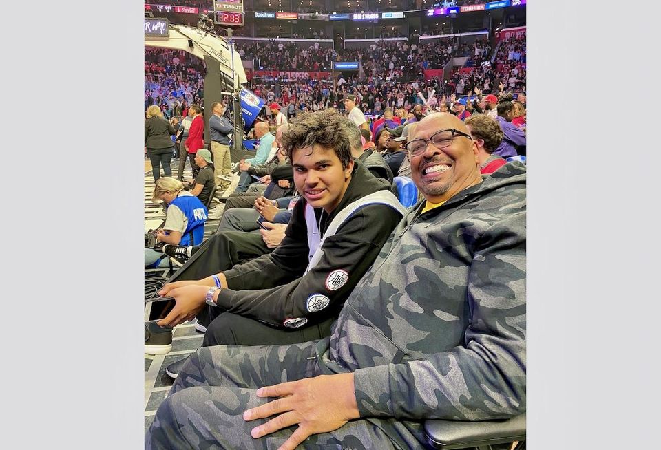 Avanath Capital's Daryl Carter with his son Nathan at a Clippers game. 
