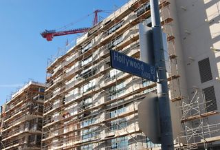 Construction crane rises over new development in Hollywood, Calif.