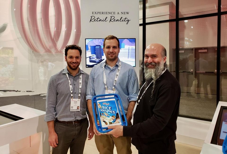 Thyng CEO Ed La Hood (right) with his team demonstrating augmented reality at the JLL booth at ICSC RECon in Las Vegas.