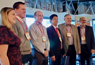 Truss' Vanessa Anderson, Paragon Commercial Group's Jim Dillavou, Lincoln Property Co.'s Kent Handleman, Colliers International's Reza Ghobadi, Parker Brown's John Parker and Unibail-Rodamco-Westfield's Larry Green pose for a picture at Bisnow's State of the Valley and Tri-Cities event at New York Life's 2300 West Empire Avenue building in Burbank.

