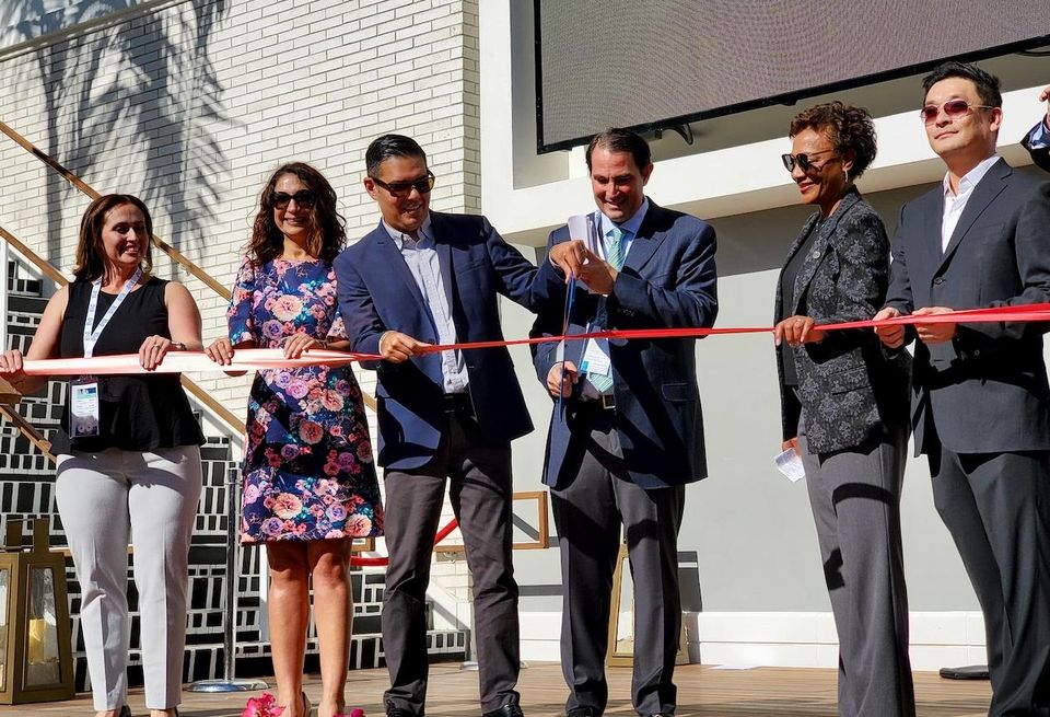 Long Beach Mayor Robert Garcia helps CenterCal Properties President Jean Paul Wardy (both center) cut the ceremonial ribbon during the grand opening of CenterCal Properties $200M retail shopping center in Long Beach
