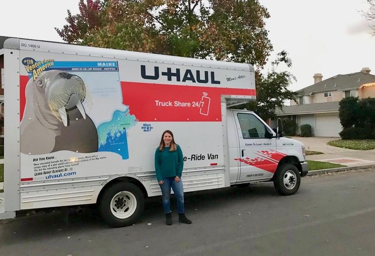 Jenifer Levy, an Orange County resident, poses in front of the U-Haul she filled up with donations to take to Camp Fire victims.