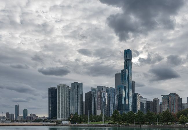 Chicago skyline under a cloudy sky.