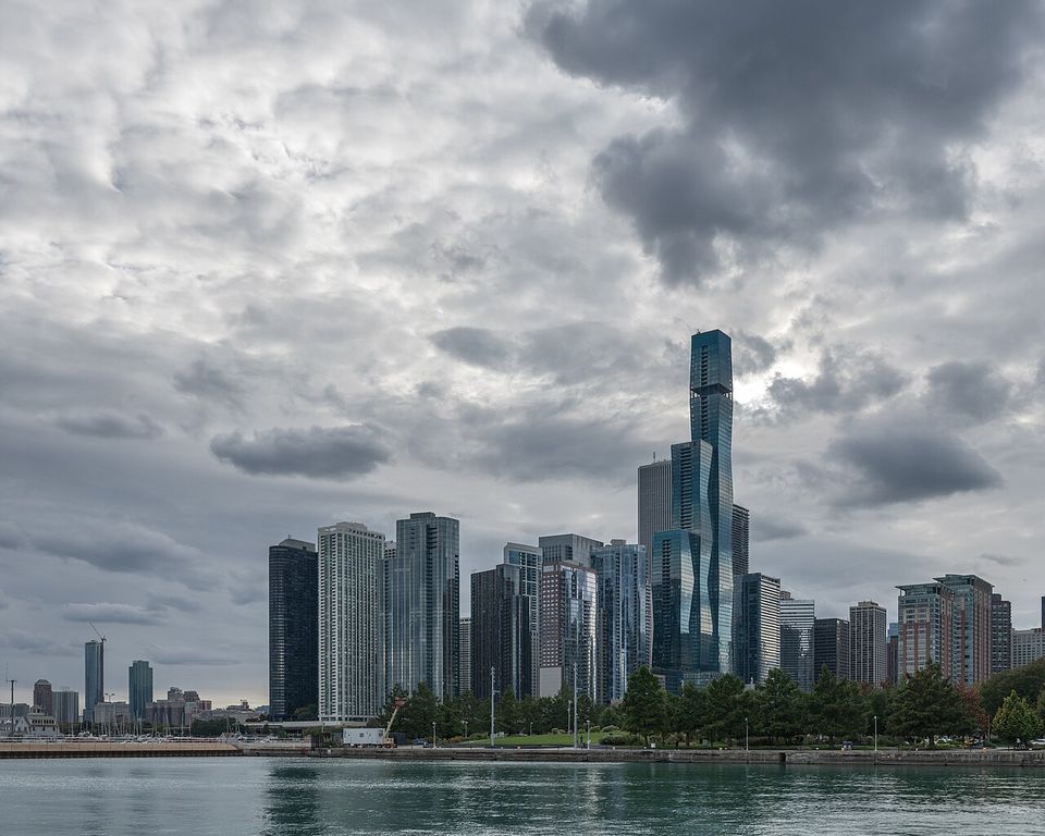 Chicago skyline under a cloudy sky.