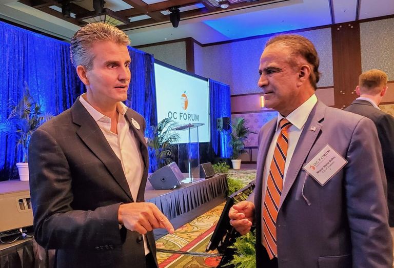 Disneyland President Josh D'Amaro and Anaheim Mayor Harry Sidhu talk after the OC Forum event at Disney's Grand Californian Hotel & Spa.