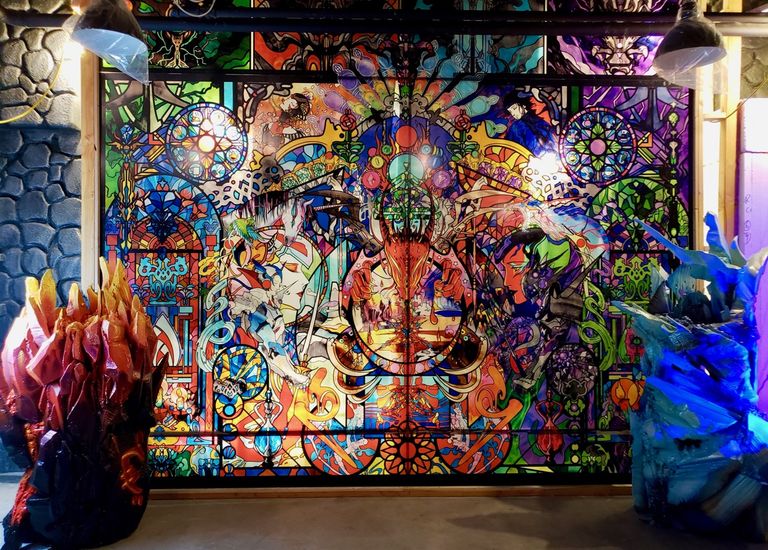 A 14-foot stained glass mural at Requiem: Coffee, Tea, and Fantasy in Anaheim