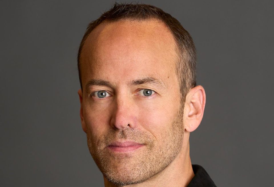 A headshot of Winston Fisher