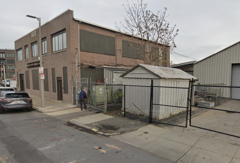 The site of developer Sing Ming Chan's 75-unit multifamily development at 45-51 D St. in South Boston.