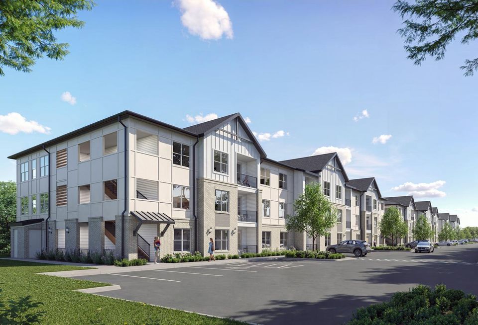 Rendering of a white three-story apartment building