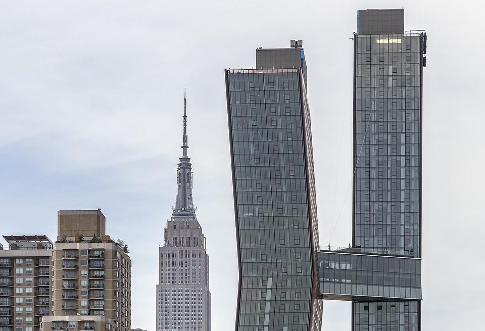 The American Copper Buildings at 626 First Avenue, Manhattan, New York, with the Empire State Building in the background.